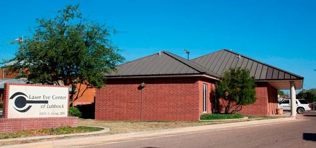 Exterior of red-brick building with signage saying Laser Eye Center of Lubbock